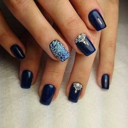 Nails by a dark blue dress photo
