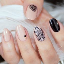 Beige nails with black pattern photo