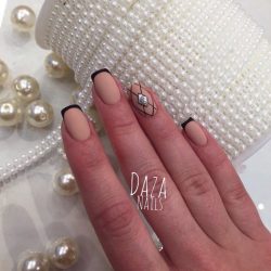 Beige nails with black pattern photo