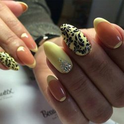 Yellow nails with black pattern photo