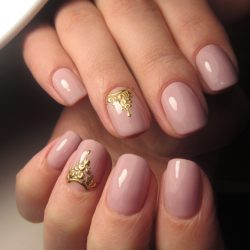 Metallic gold nail polish photo