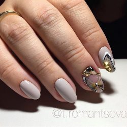 Delicate nails with a butterfly photo