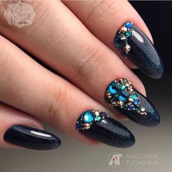 Black nail polish with sparkles photo