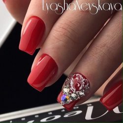 New Year’s nails by a red dress photo