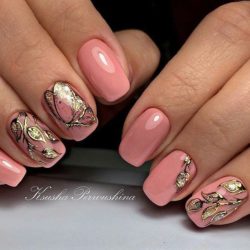 Manicure on a pink background photo