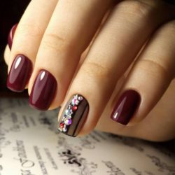 Maroon nails with a picture photo