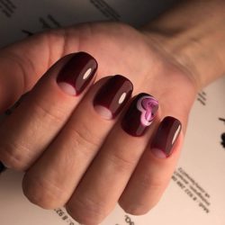 Maroon nails with a picture photo