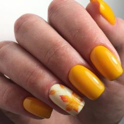 Yellow nails with a picture photo